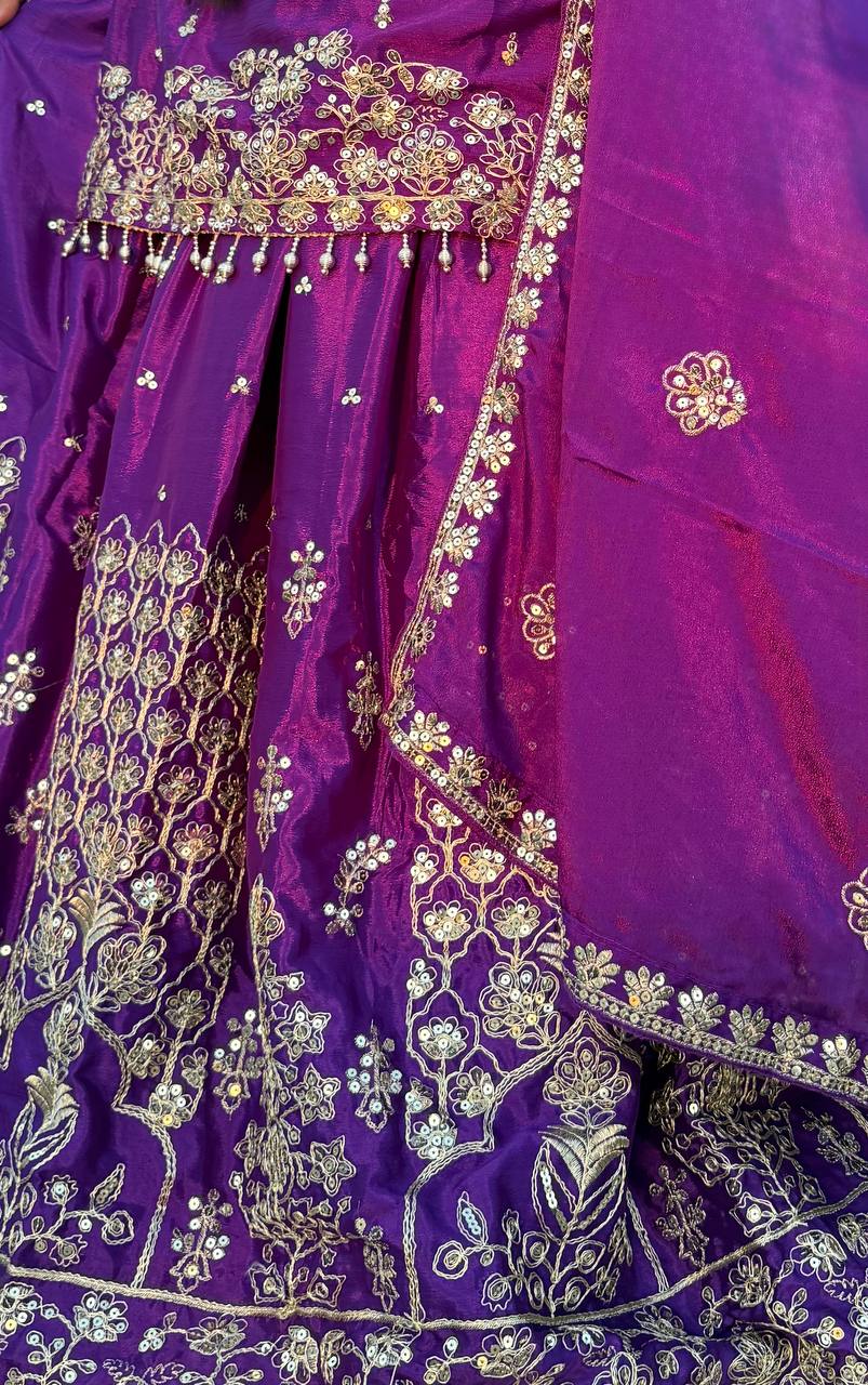 Purple fabric with gold and white embroidery